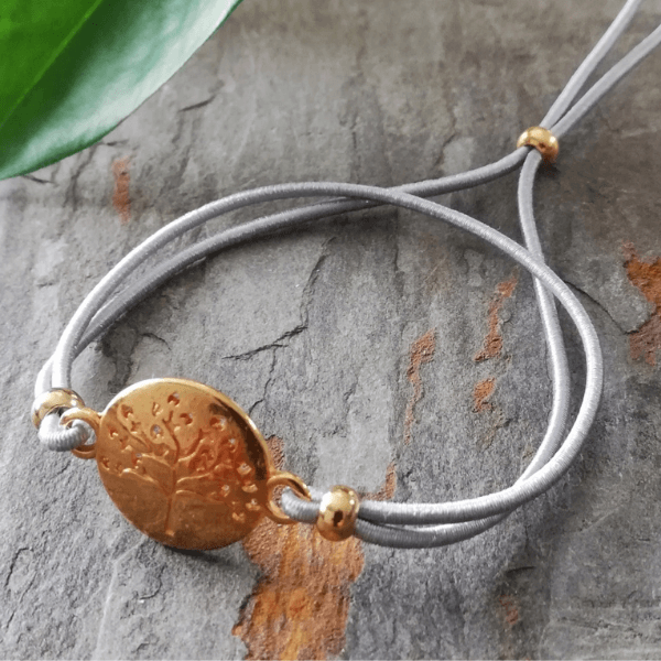 armband elastiek grijs levensboom goud